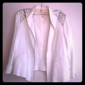 Chico’s White jacket with silver stones.